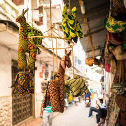 Clothes hanging for sale at market stall