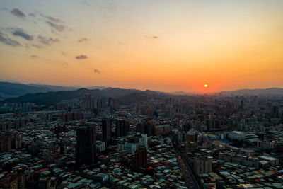 High angle view of buildings against sky during sunset