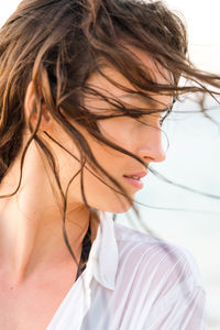 Close up portrait of a young woman at the beach