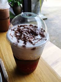 Close-up of coffee in glass on table