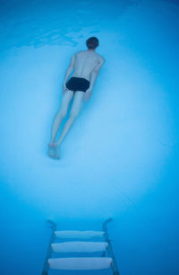 Woman swimming in pool