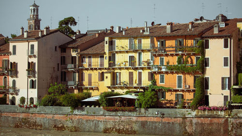 Facades of colorful buildings in front of the river water