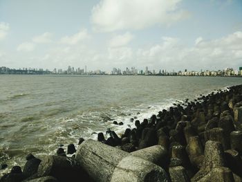 Scenic view of sea against cloudy sky