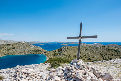 Scenic view of rocks against blue sky