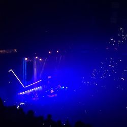 Low angle view of illuminated lights at night