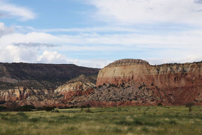 View of rocky landscape against cloudy sky