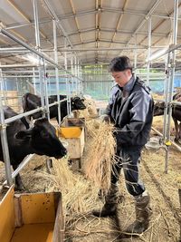 Rear view of man working at farm