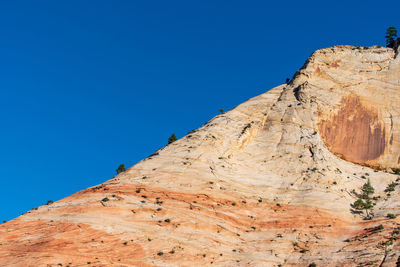 Zion national park low angle landscape of almost barren striped stone hillside at checkerboard mesa