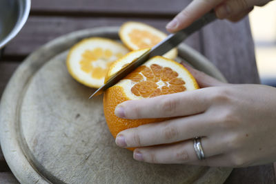 Close-up of person preparing food on table