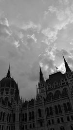Low angle view of church against cloudy sky