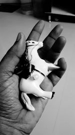 Close-up of hand holding paper