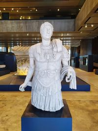 Statue of buddha on table