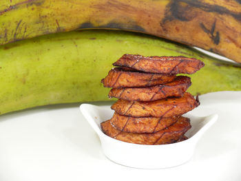 Stack of fried banana slice on table