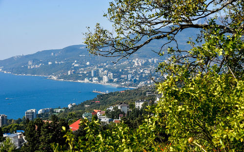 High angle view of townscape by sea