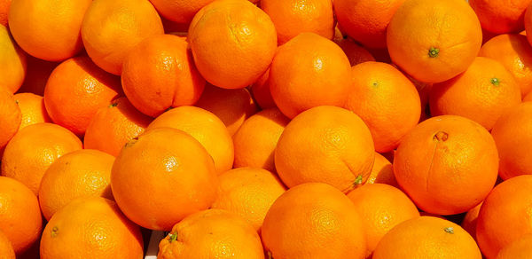 Full frame shot of oranges at market stall