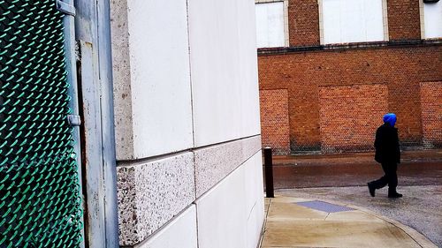 Man walking on sidewalk