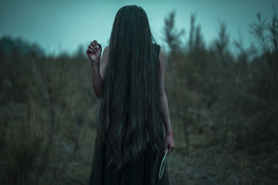 Woman standing on field