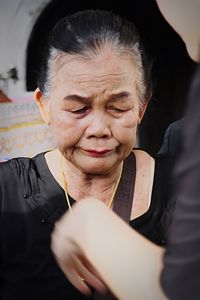 Portrait of smiling woman holding camera