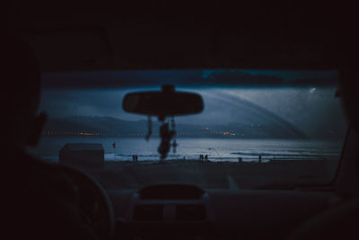 Rear view of man on airplane window