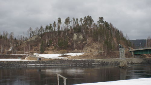 View of lake against cloudy sky