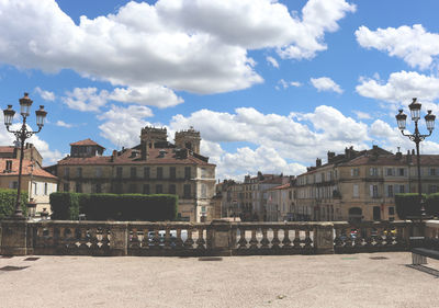 Buildings in city against sky