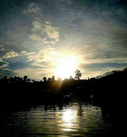 Scenic view of sunset over river