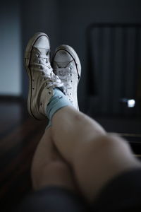 Low section of man sitting indoors