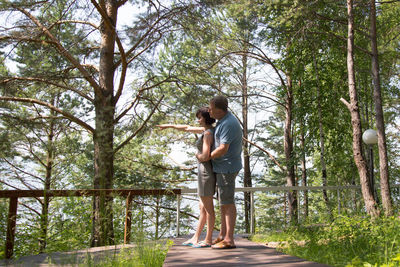 Full length of man standing in forest