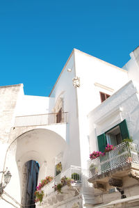 Low angle view of building against clear blue sky