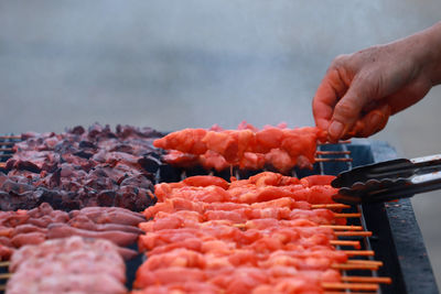 Cropped image of person preparing food