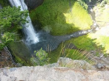 High angle view of water flowing through rocks