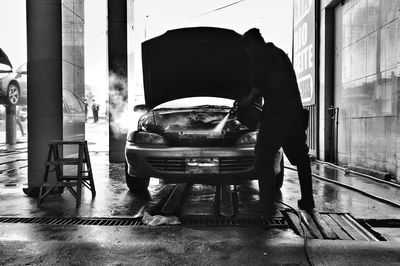 A man working in a car.