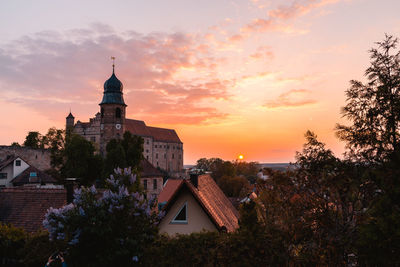 Buildings against sky during sunset