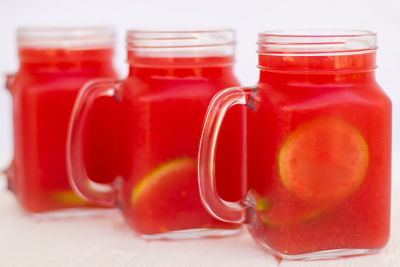 Close-up of drink in glass jar on table