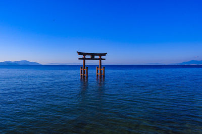 Torii of shirahige shrine on lake biwa