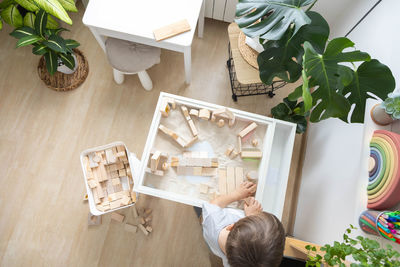 High angle view of woman sitting on table