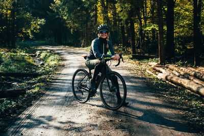 Portrait of a woman with a gravel bike