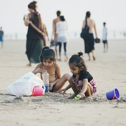 Two people playing on beach