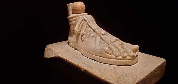 Close-up of statue against black background