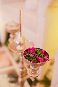 Close-up of pink rose on table