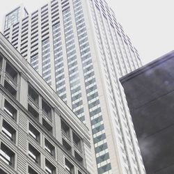 Low angle view of office buildings against sky