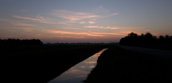 Scenic view of silhouette landscape against sky during sunset