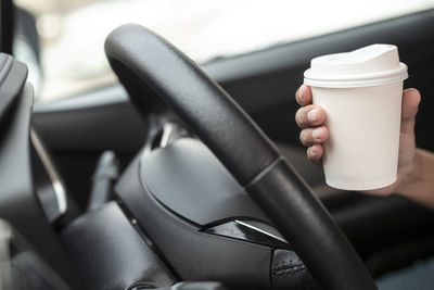 Woman holding coffee cup