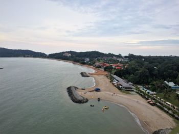 High angle view of road by sea against sky