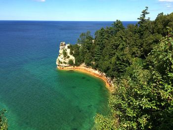 Scenic view of sea against clear blue sky