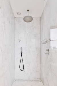 Electric lamp hanging on wall at home