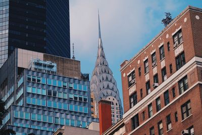 Low angle view of skyscrapers against sky