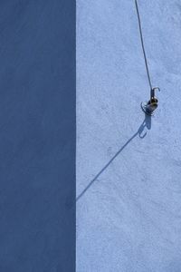 Low angle view of concrete wall in blue