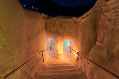 High angle view of illuminated staircase in snow