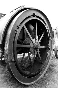 Close-up of old wheel on field